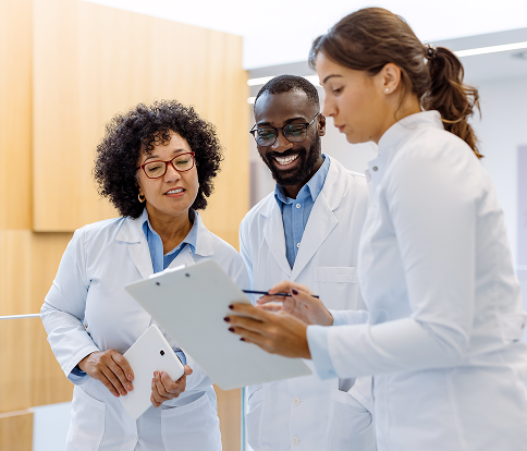 Smiling physician with a laptop